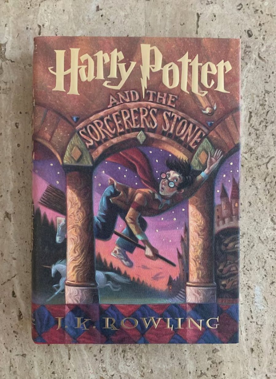 A warm photograph of a Harry Potter book collection